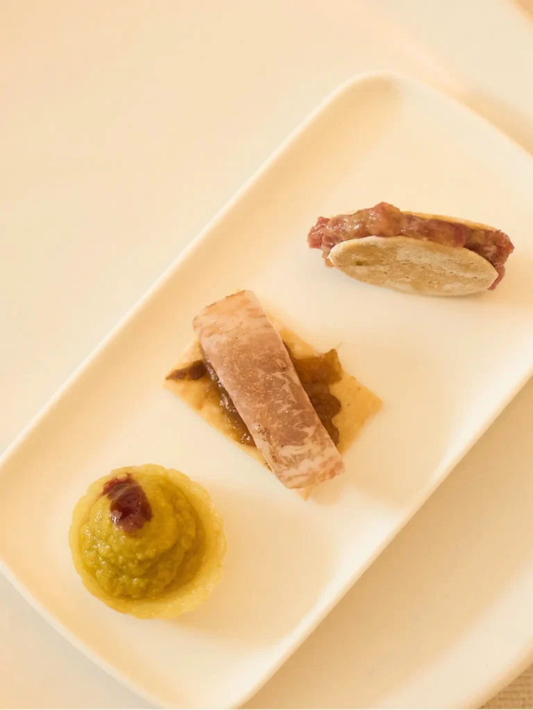 Blazquez Iberico Ventresca on crisp bread and pickled onion
